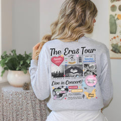 a woman wearing a gray sweatshirt with the words the gras tour on it