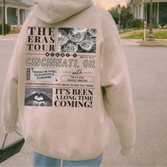 a person wearing a hoodie with a poster on it