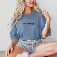 a woman sitting on a table with her legs crossed