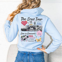 a woman wearing a blue hoodie with pictures on it