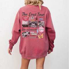a woman is wearing a pink sweatshirt with pictures on it