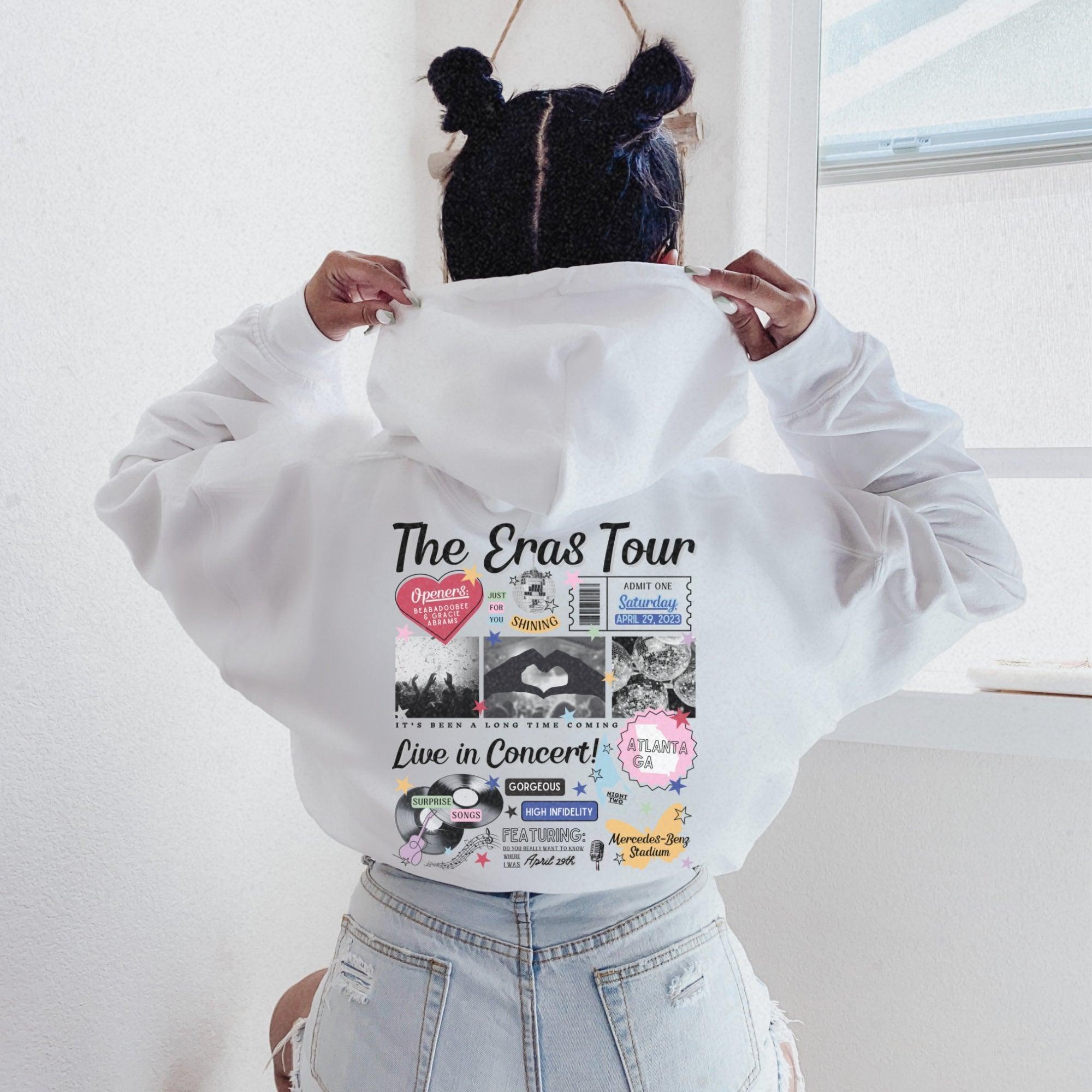 a woman wearing a white shirt with a hoodie on her head