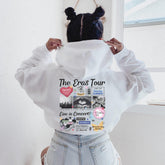 a woman wearing a white shirt with a hoodie on her head