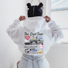 a woman wearing a white shirt with a hoodie on her head