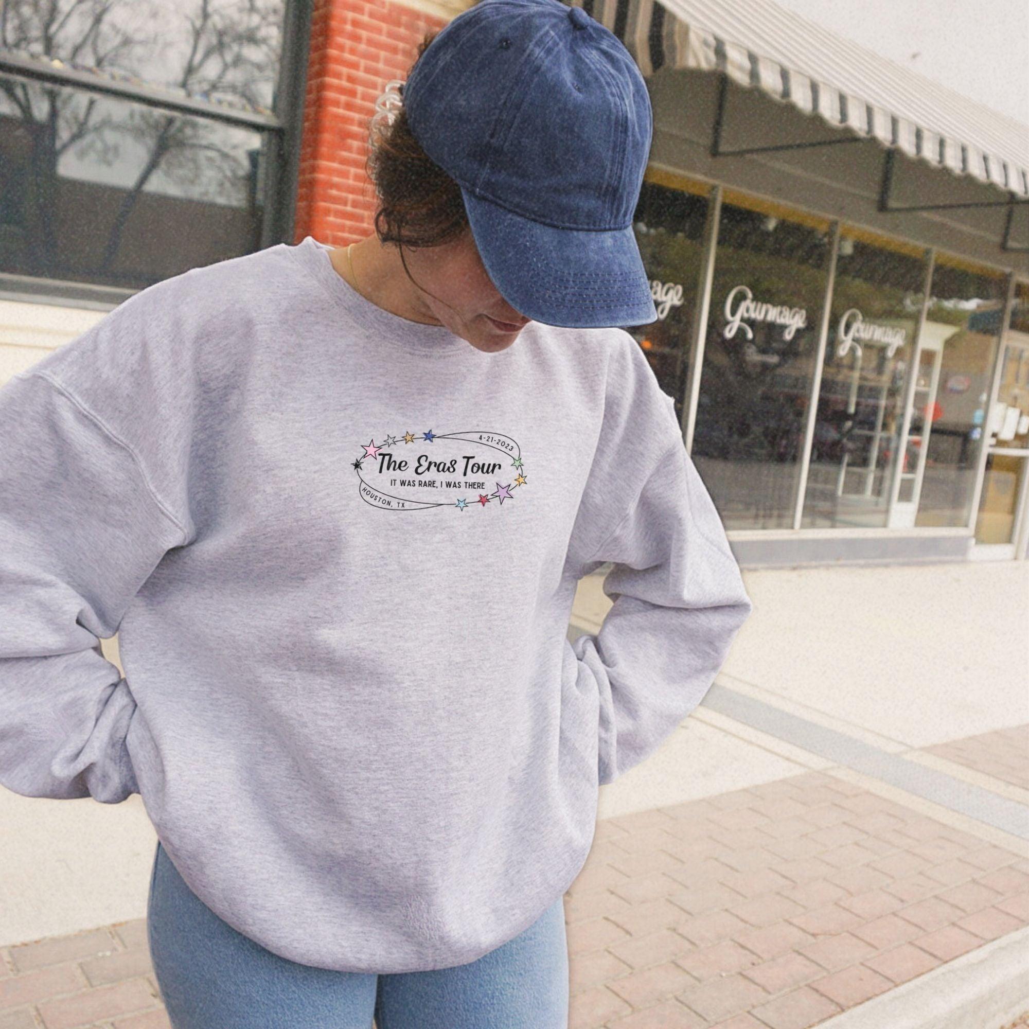 a woman in a blue hat is standing on a skateboard