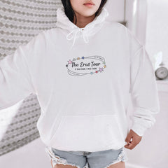 a woman wearing a white hoodie with the words the end tour on it