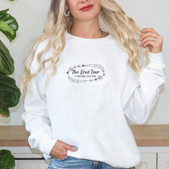 a woman wearing a white sweatshirt with the words the end four printed on it