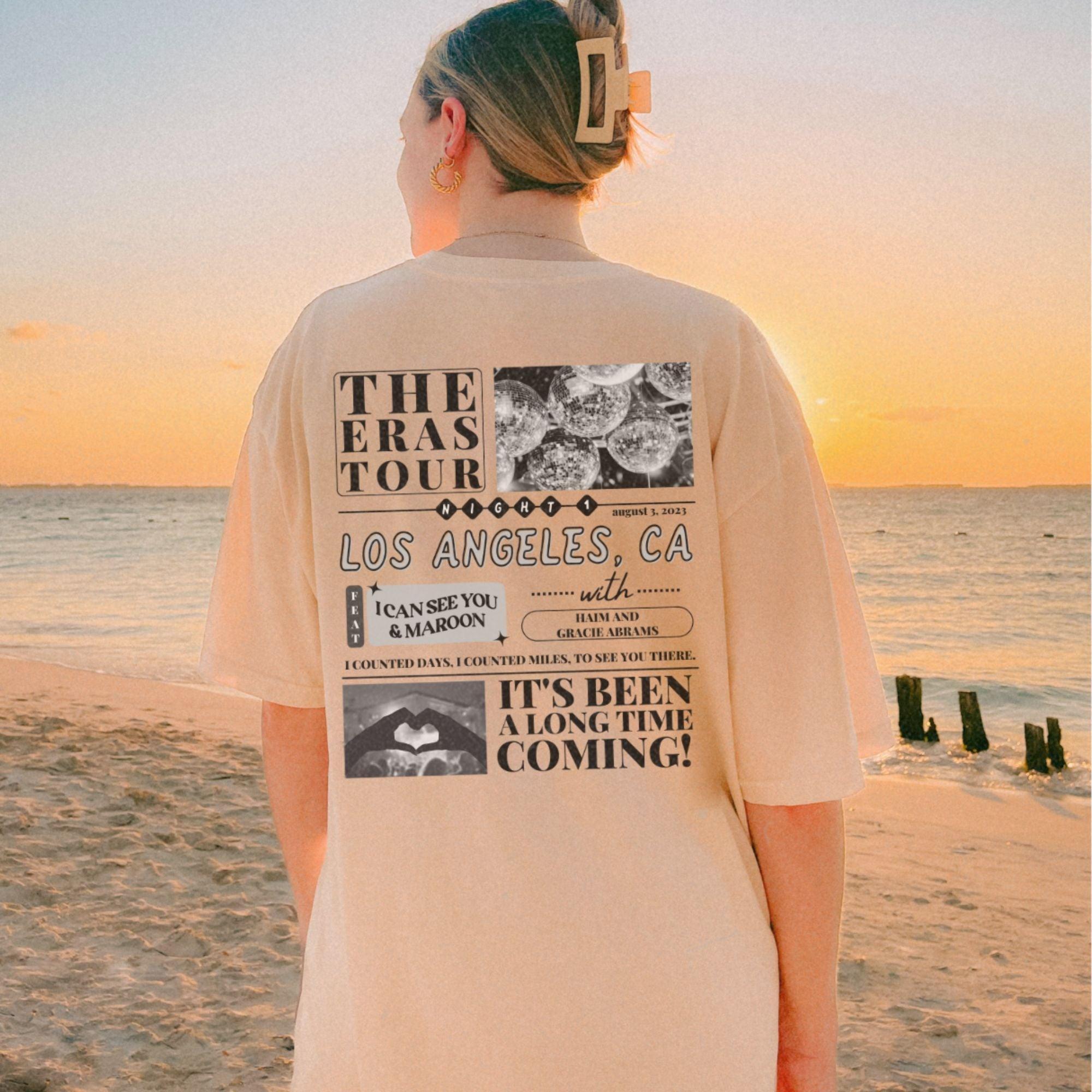 a person standing on a beach near the ocean
