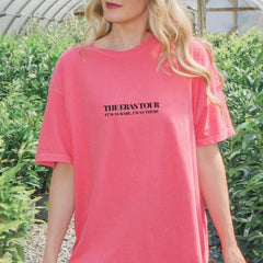 a blonde woman wearing a pink shirt with the words the perstoror on it