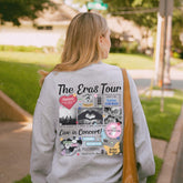 a woman walking down a sidewalk with a bag on her shoulder