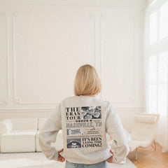 a woman standing in front of a white couch
