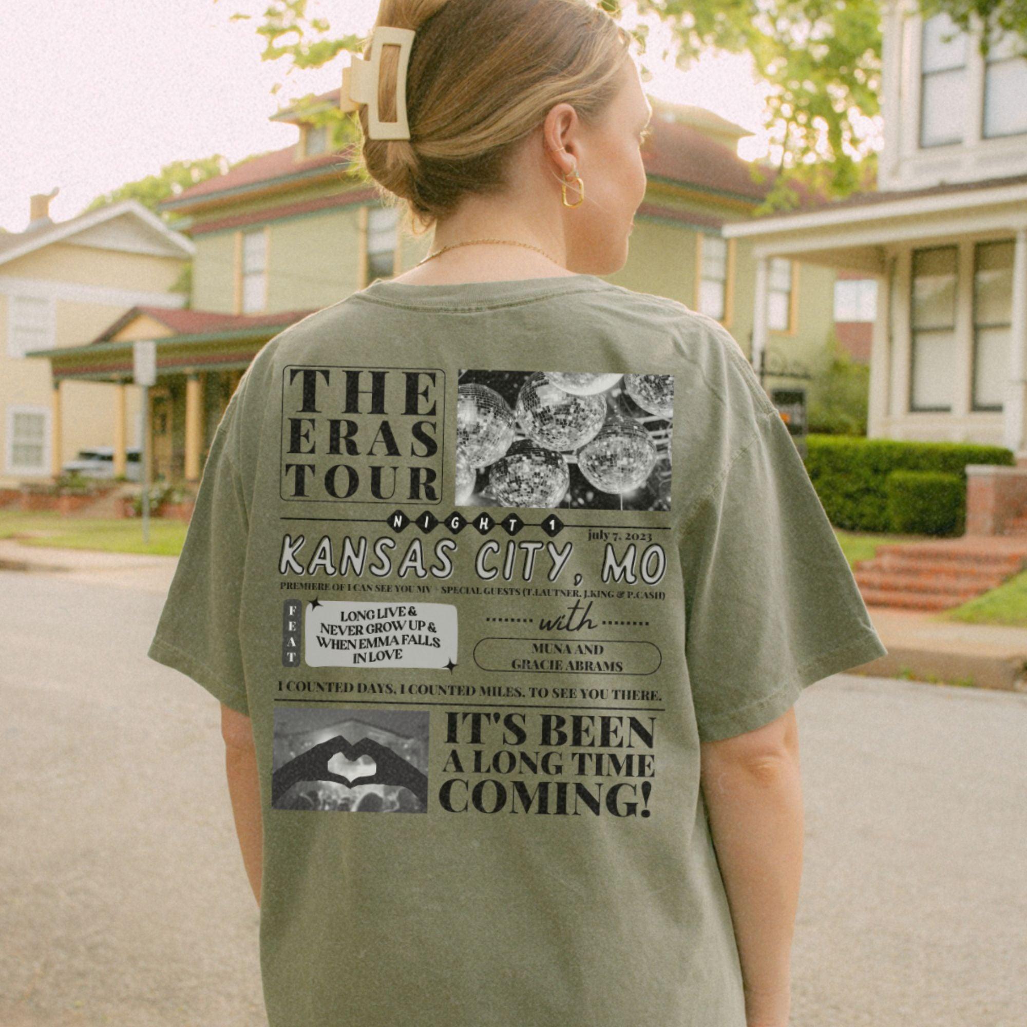 a woman standing on a street with a skateboard