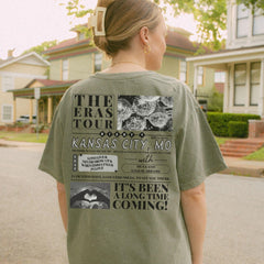 a woman standing on a street with a skateboard