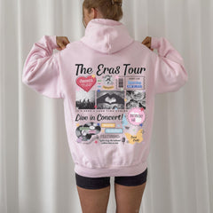 a woman wearing a pink hoodie with pictures on it