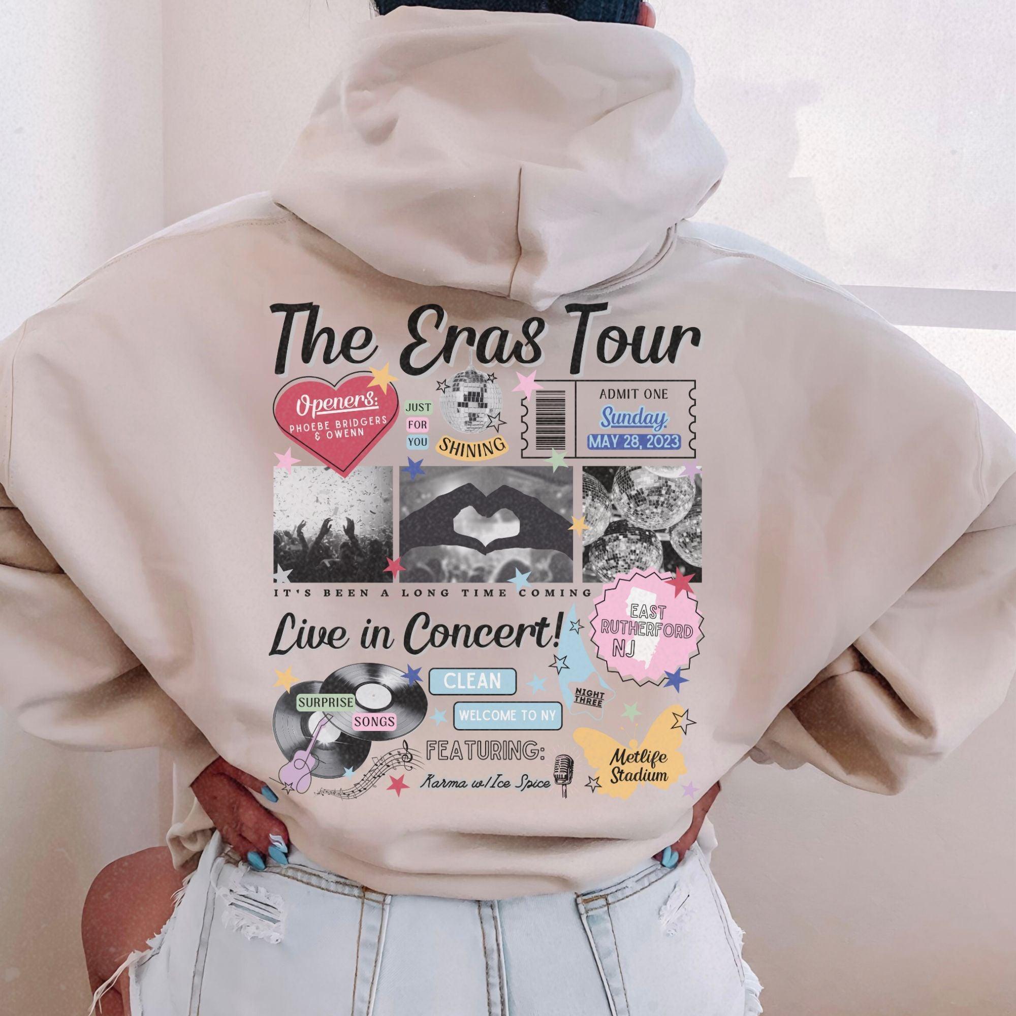 a woman wearing a hoodie with the words the eras tour on it