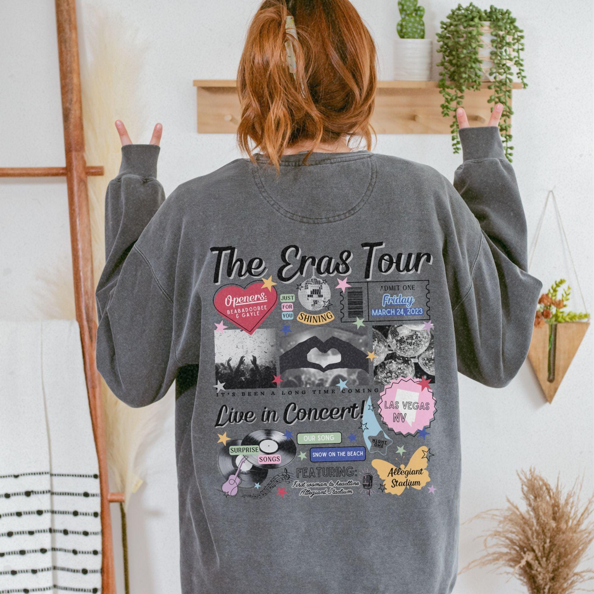 a woman wearing a grey sweatshirt with the words the cross tour printed on it