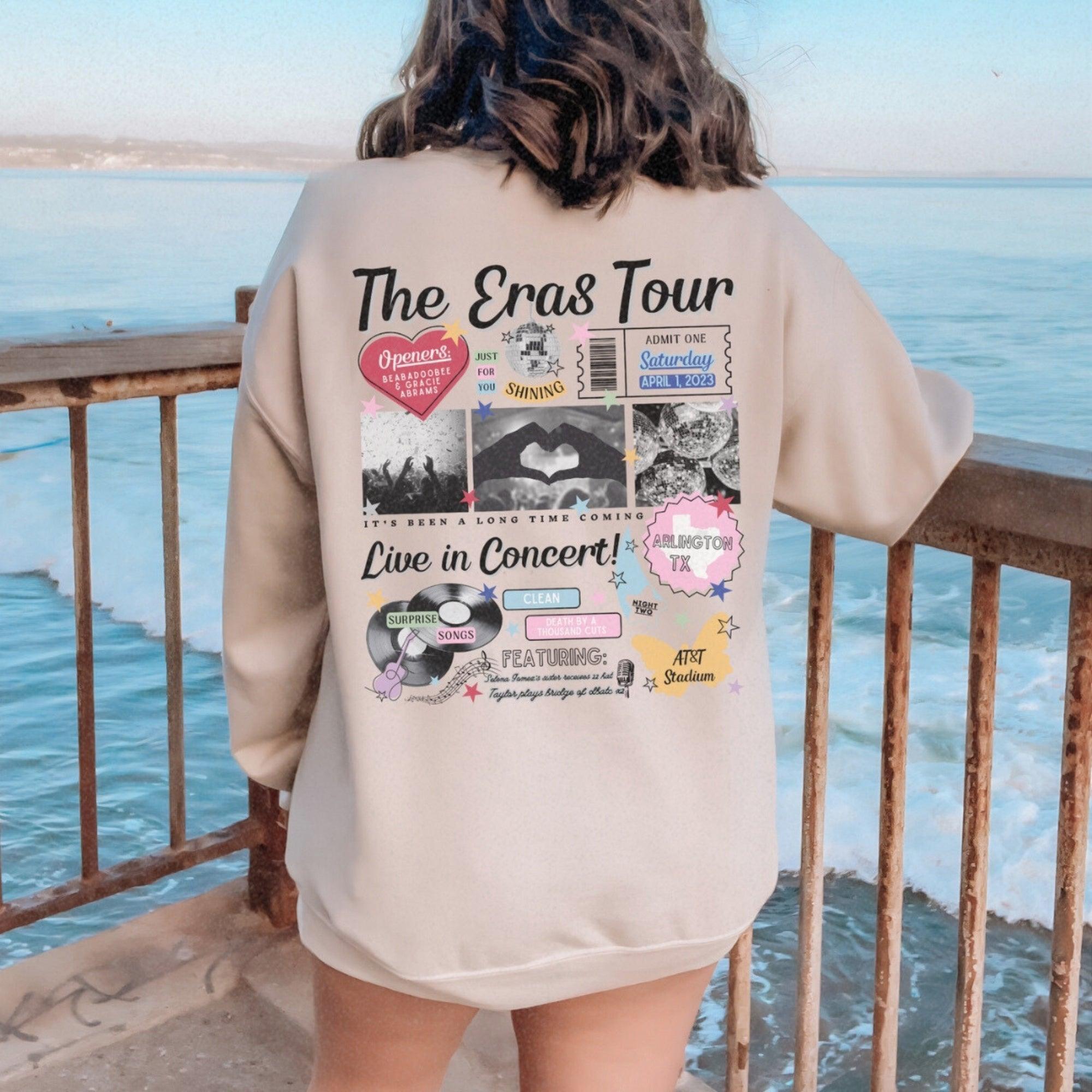 a woman standing on a balcony looking at the ocean