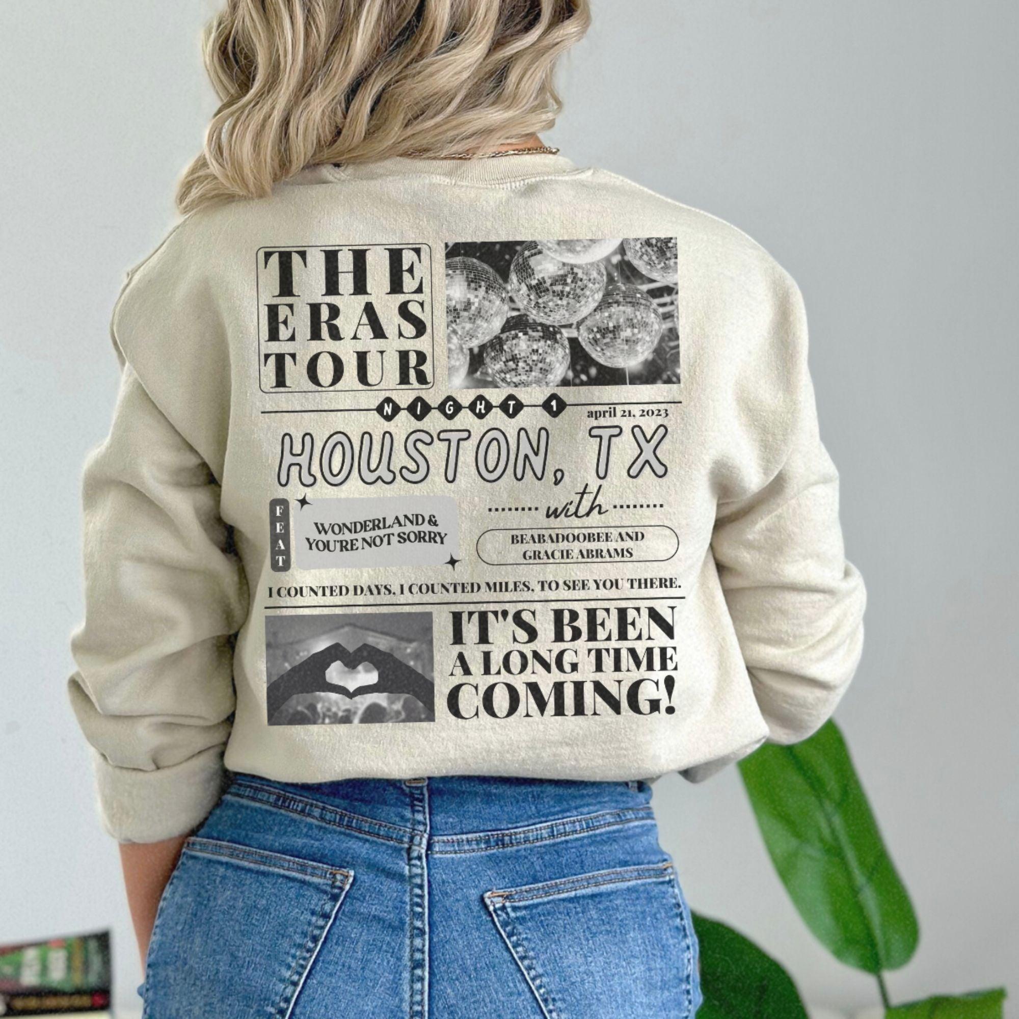 a woman wearing a sweatshirt with the words houston on it