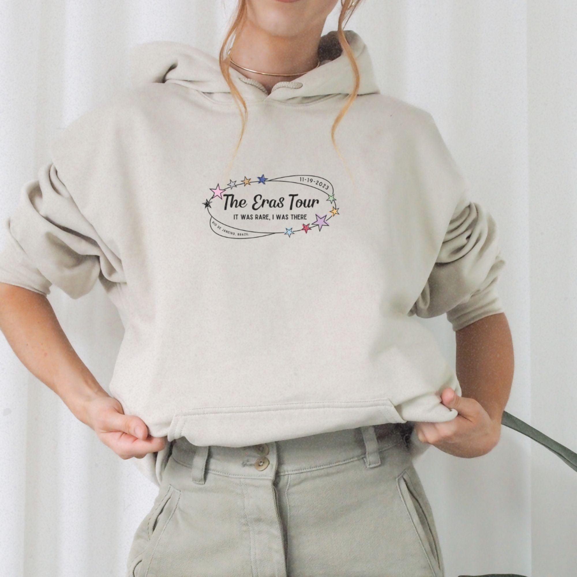 a woman wearing a sweatshirt with the words the end town on it