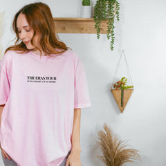 a woman wearing a pink t - shirt with the words the best for the rest