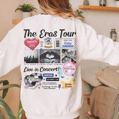 a woman wearing a white sweatshirt with the words the eras tour on it