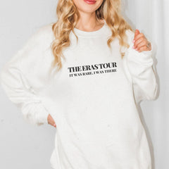 a woman wearing a white sweatshirt with the words, the overstour it's