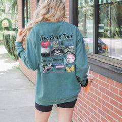 a woman standing outside of a building with her back to the camera