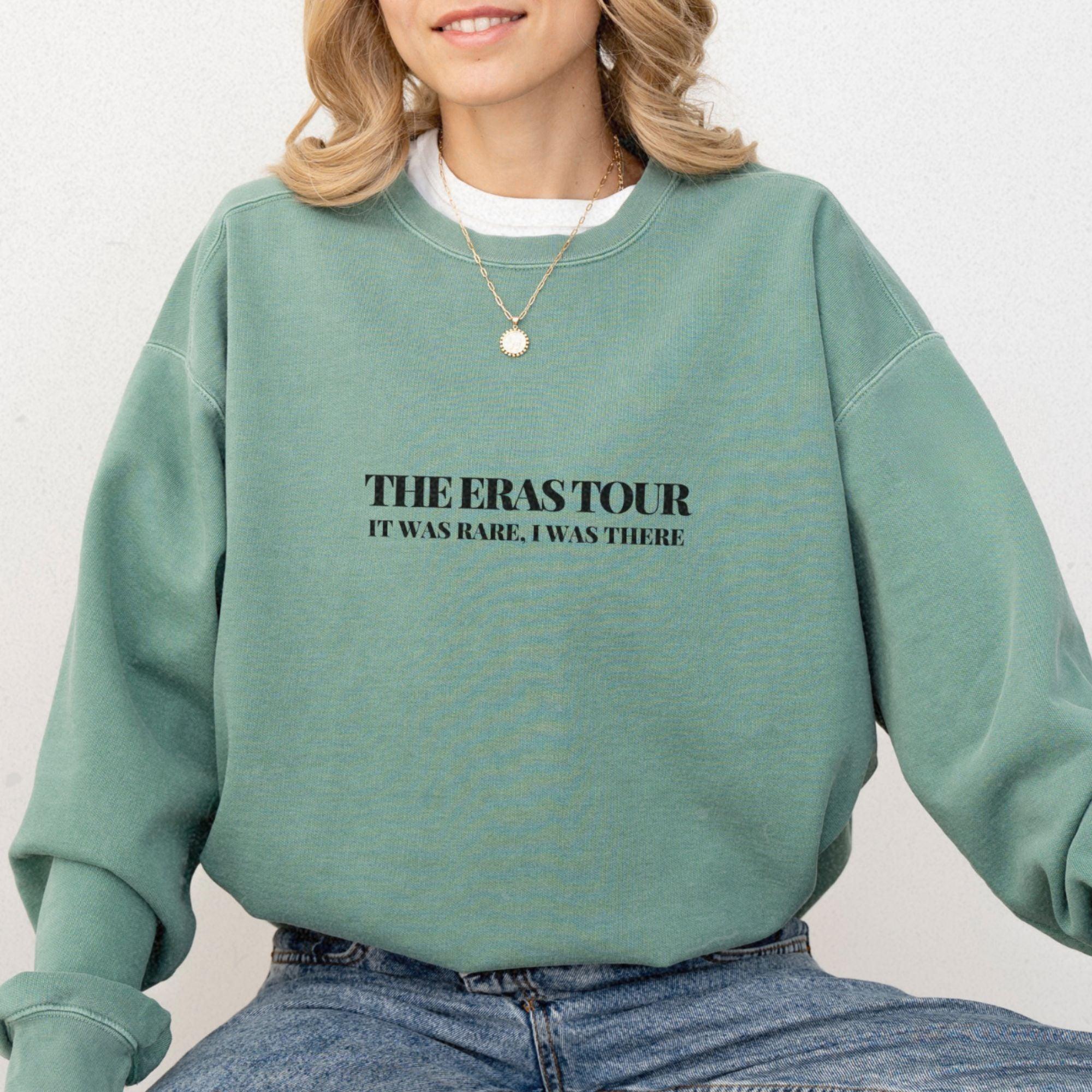 a woman wearing a green sweatshirt with the words, the overstoryr it was
