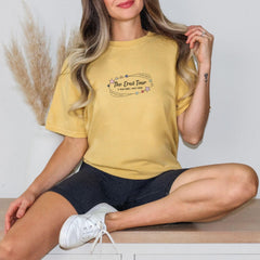 a woman sitting on a table with her legs crossed