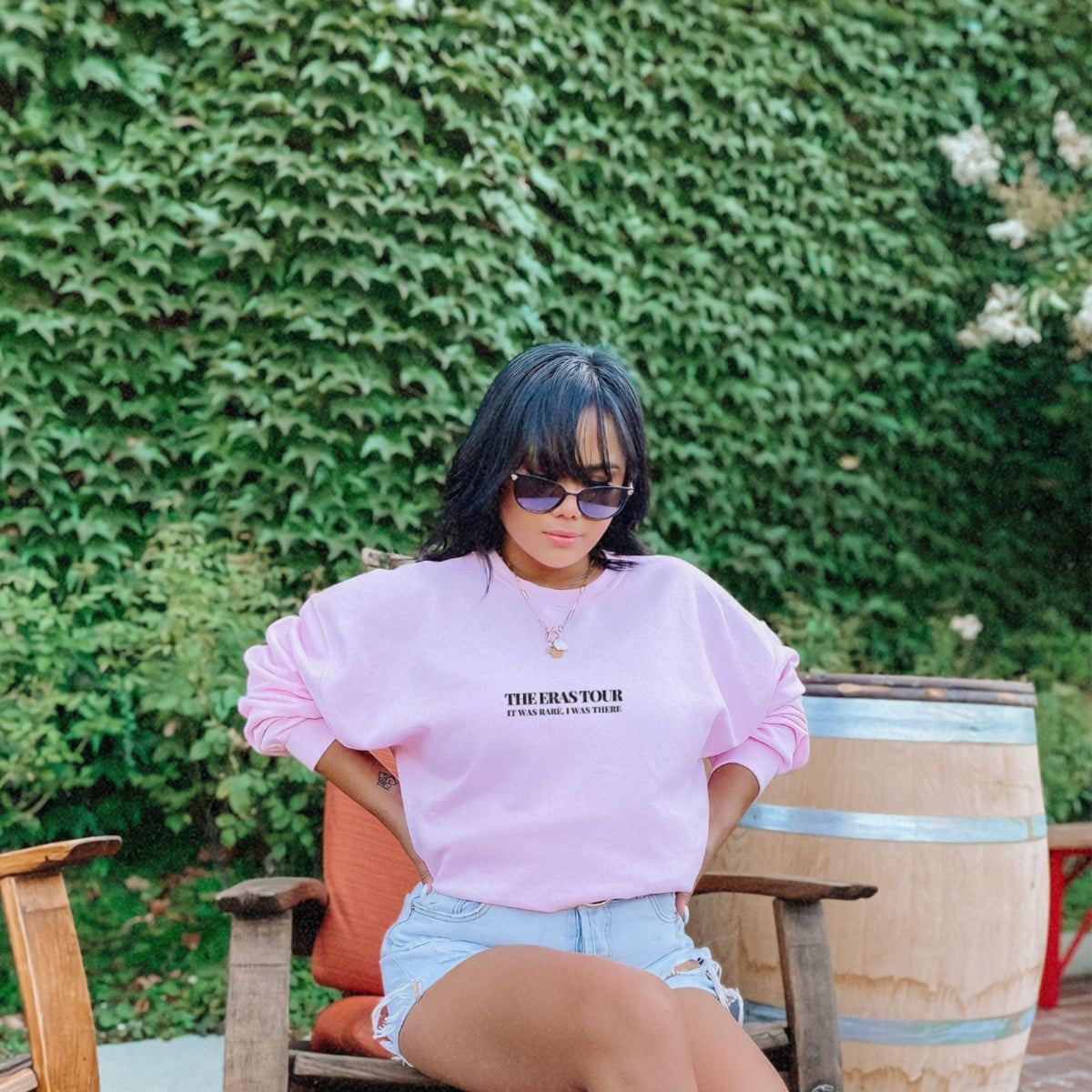 a woman sitting on a chair with her legs crossed