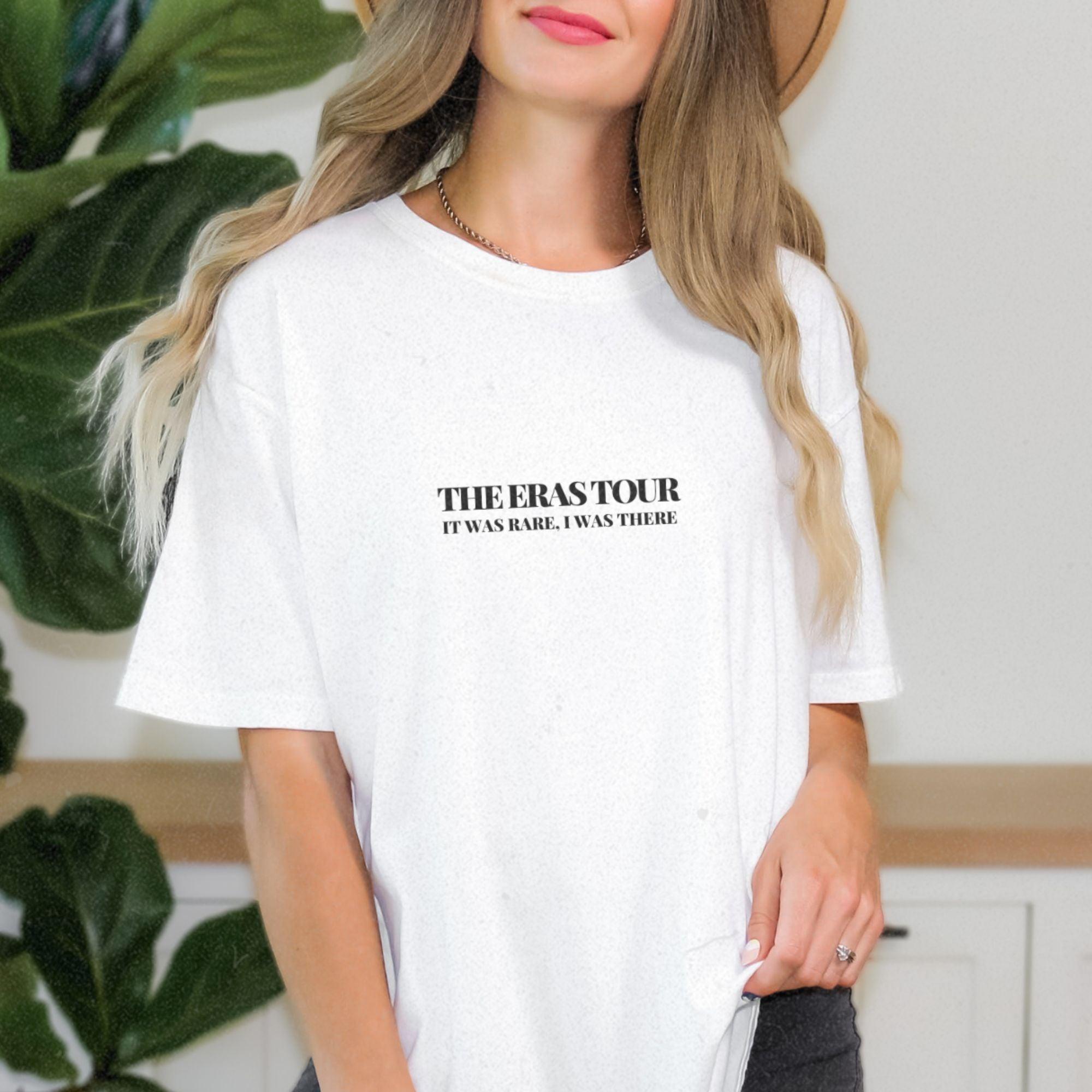 a woman wearing a white t - shirt with the words the erastor on it