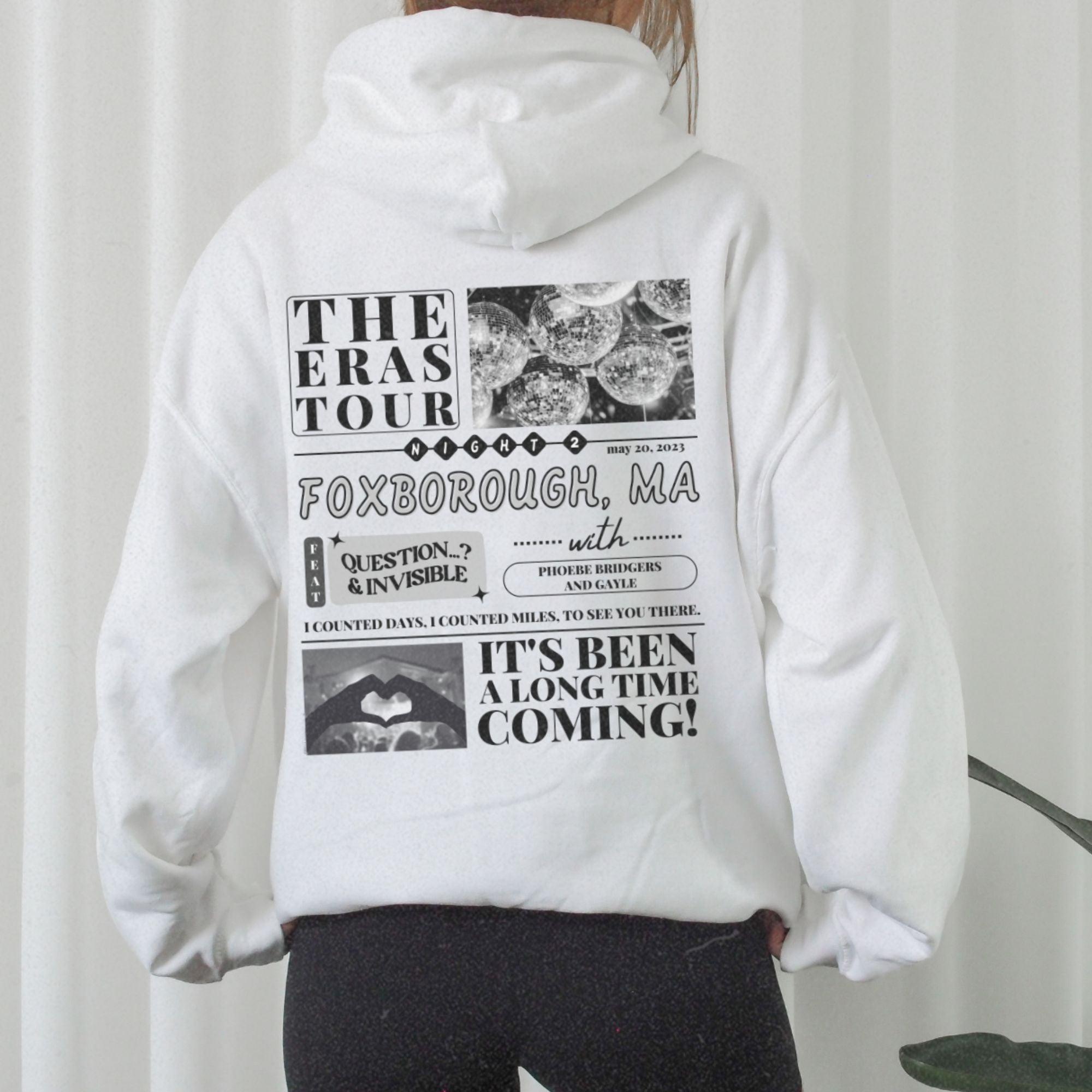 a person wearing a white hoodie with a bunch of words on it